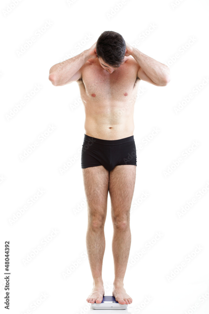 Healthy young man man standing on scales scale Isolated Healthy young man man standing on scales scale Isolated