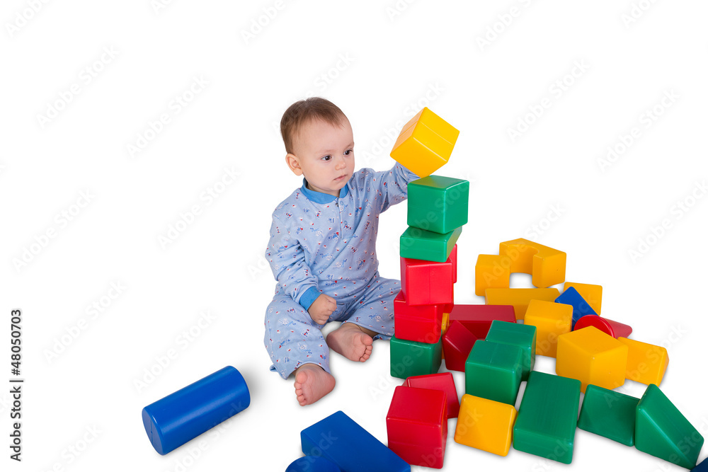 child playing with plastic blocks and cubes child playing with plastic blocks and cubes