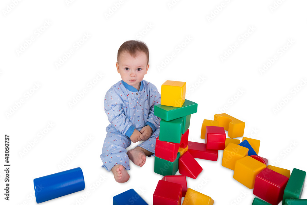 child playing with plastic blocks and cubes child playing with plastic blocks and cubes