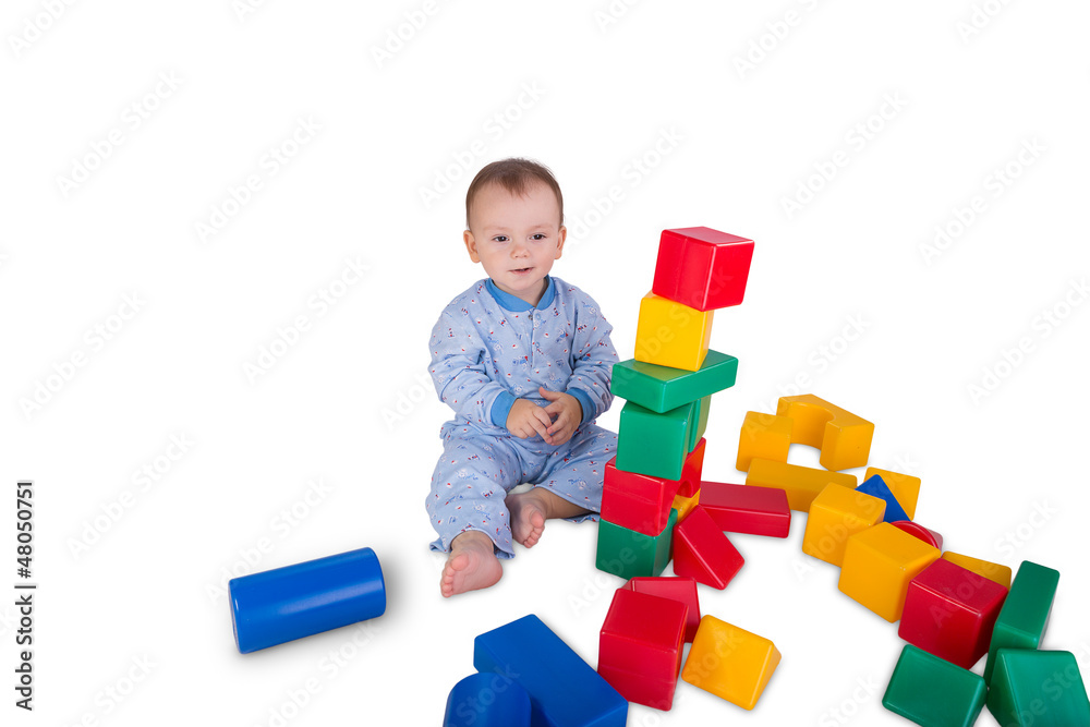 child playing with plastic blocks and cubes child playing with plastic blocks and cubes