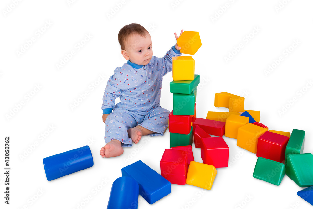 child playing with plastic blocks and cubes child playing with plastic blocks and cubes