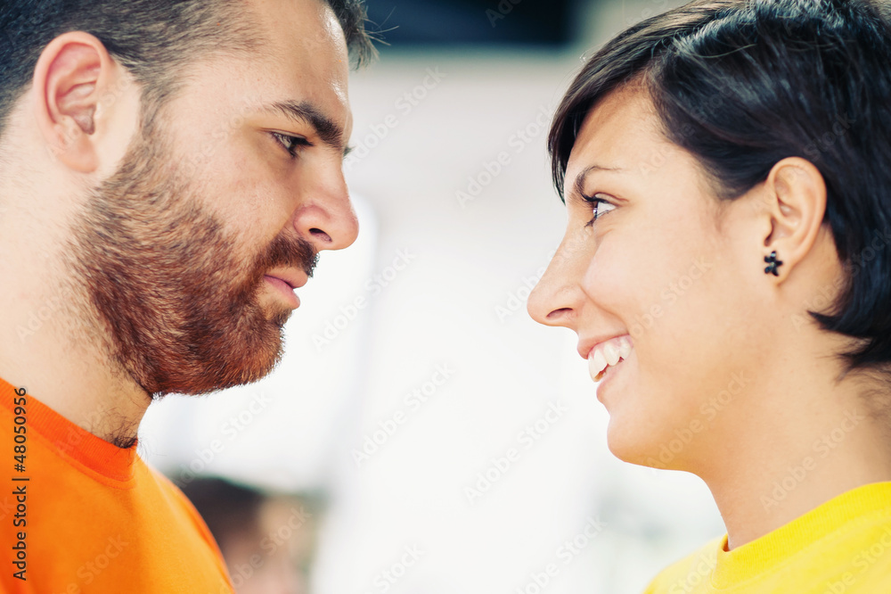 Young couple looking at each others. Young couple looking at each others.