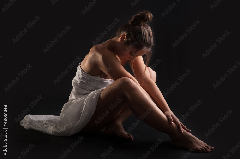 Intimate woman portrait wearing white dress 