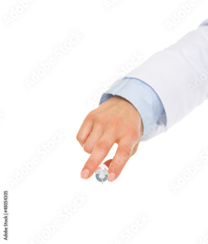 Closeup on hand of medical doctor holding syringe