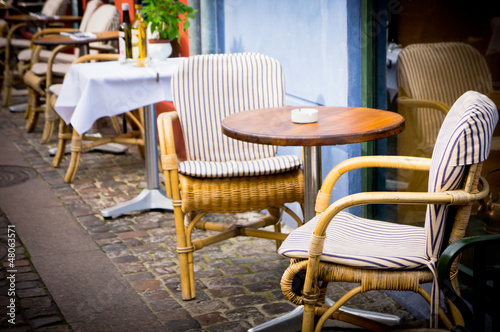 Vintage old fashioned cafe chairs with table in Copenhagen  Denm