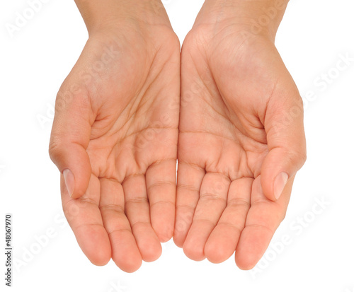 Beautiful cupped hands of young woman - cut out on white
