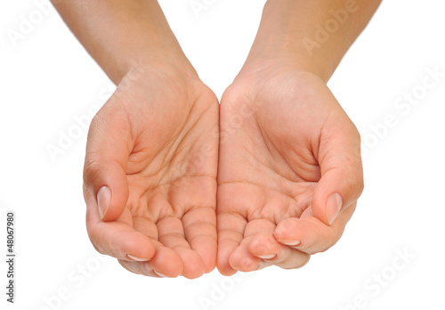 Beautiful cupped hands of young woman - cut out on white