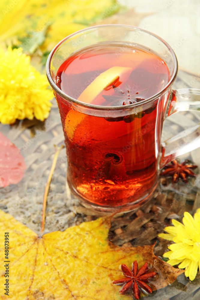 cup of hot drink and autumn leaves, close up cup of hot drink and autumn leaves, close up