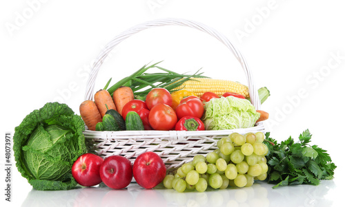 Composition with vegetables and fruits in wicker basket