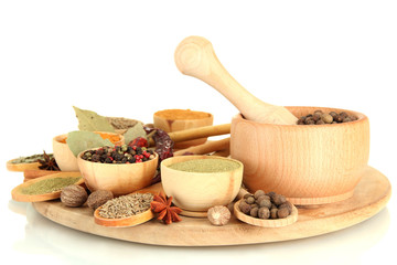 Fototapete Gewürze wooden mortar, bowls and spoons with spices isolated on white  © Africa Studio