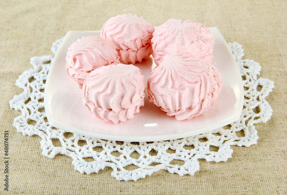 Marshmallows on plate on light background Marshmallows on plate on light background
