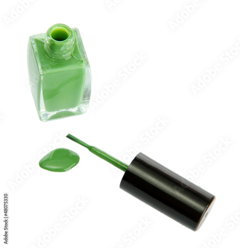 green nail polish and brush isolated on white