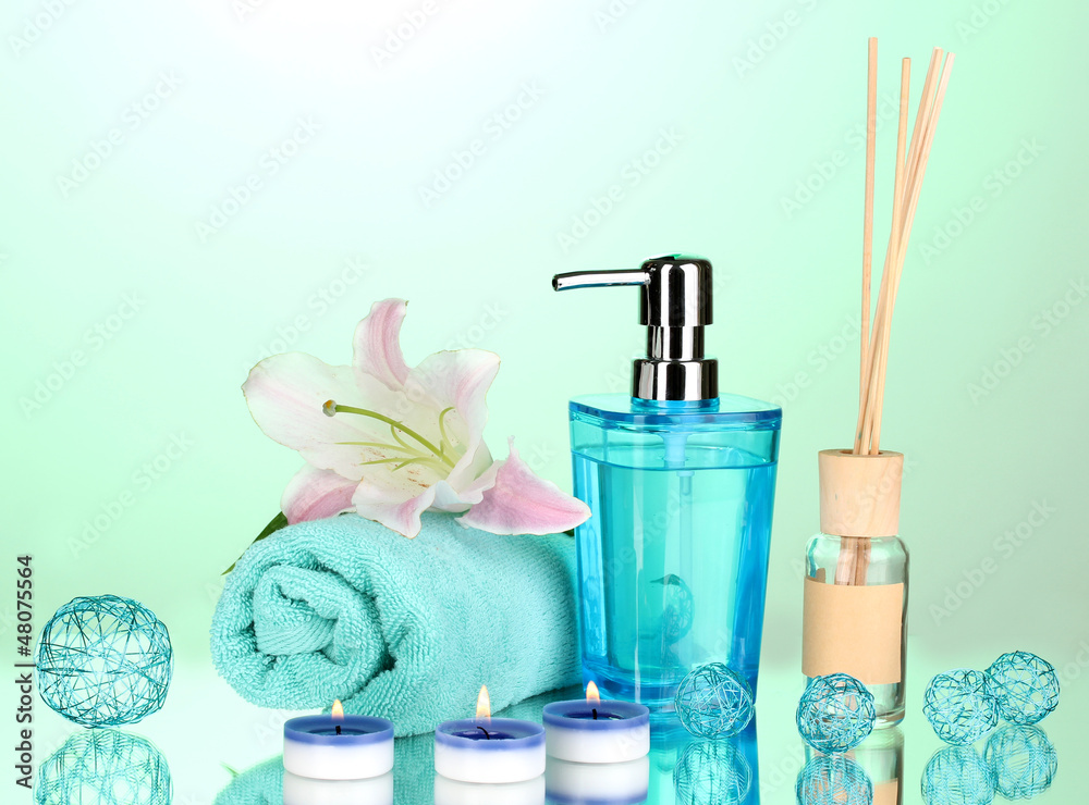 Beautiful spa setting on green background with reflection Beautiful spa setting on green background with reflection