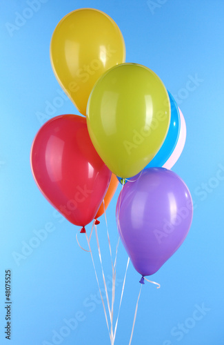 colorful balloons on blue background