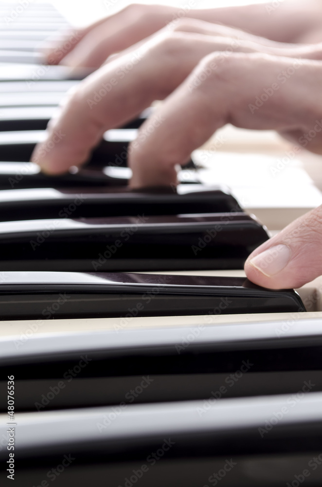Fototapeta premium Playing piano closeup
