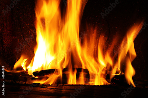 Fire in a fireplace. Fire flames on a black background