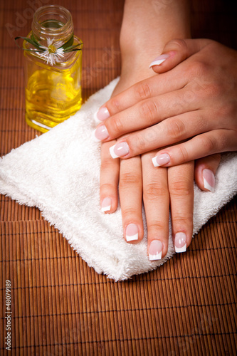 Woman s french manicure and pedicure 