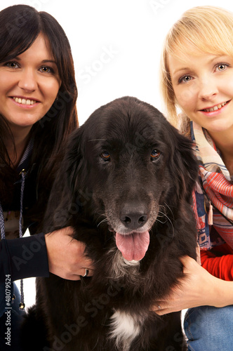 Two young woman with dog