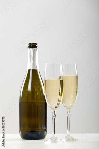 Bottle of champagne and two glasses