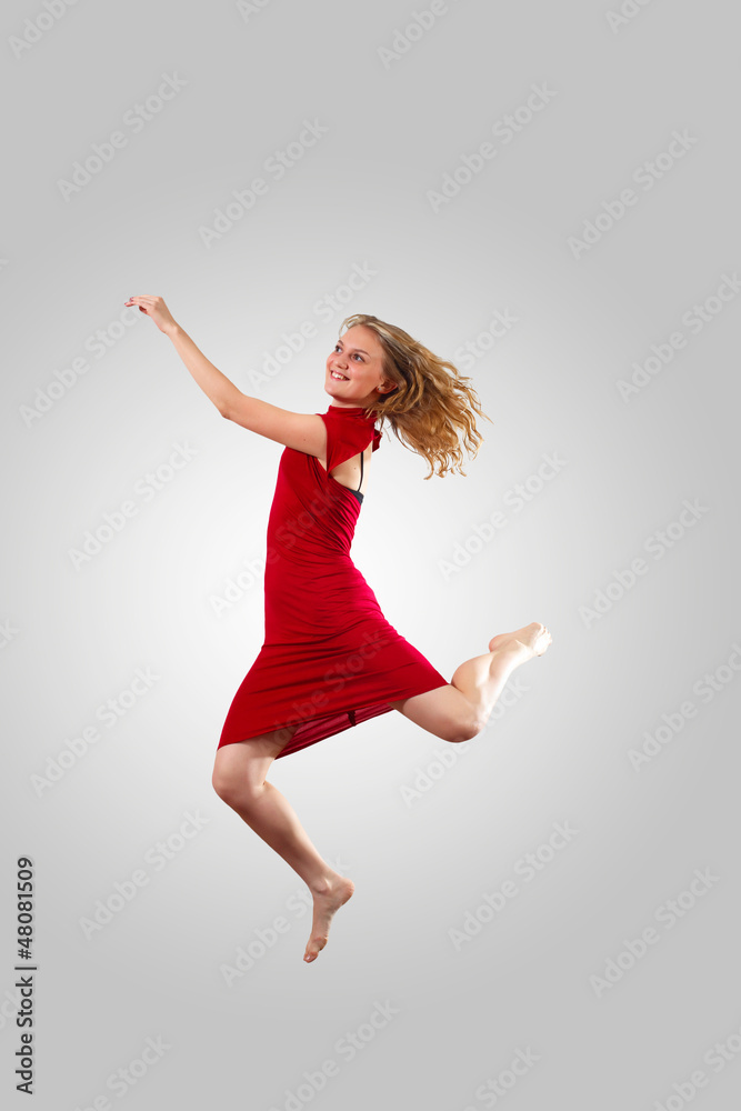 Young female dancer jumping