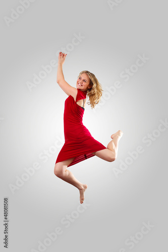 Young female dancer jumping