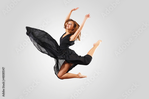 Young female dancer jumping