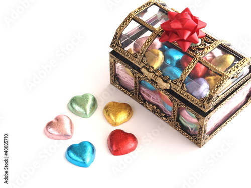 heart shape chocolate in treasure box on white background