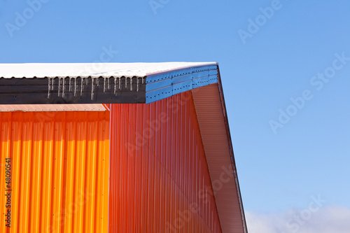 Orange metal sheet siding warehouse construction