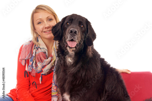 Young woman with her dog on a couch