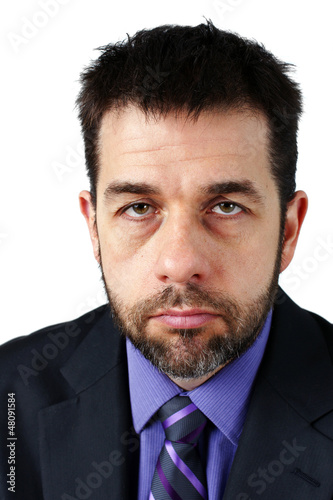 Portrait of unhappy man in suit