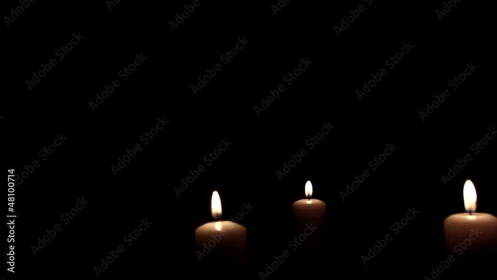 Three burning candles in dark. Three burning candles in dark.