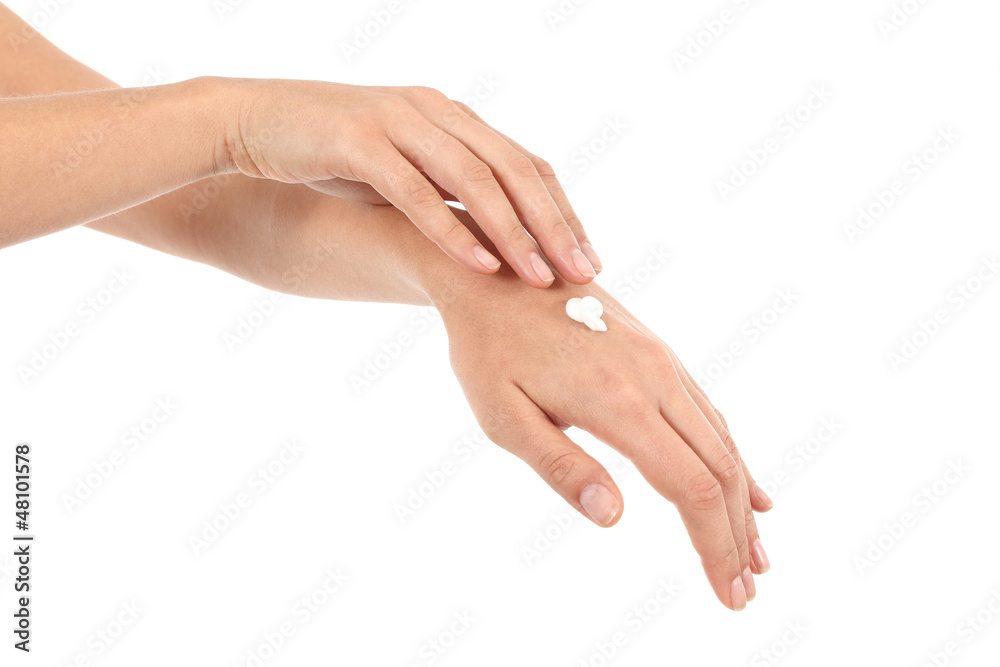Woman moisturizing her hands