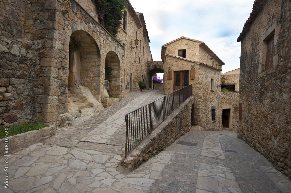 a street in the medieval village of Pals.Spain
