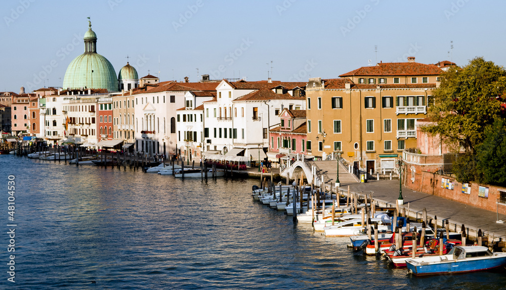 Gondola parking and cityscape of Venice