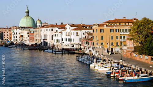 Gondola parking and cityscape of Venice