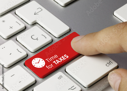 Time for taxes keyboard key. Finger