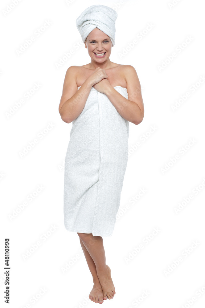 Full length portrait of a woman wrapped in towel Full length portrait of a woman wrapped in towel