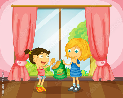 Girls eating cookies in room