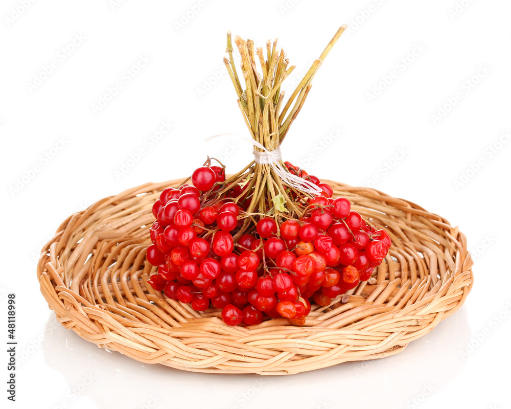 red berries of viburnum on wicker mat isolated on white red berries of viburnum on wicker mat isolated on white