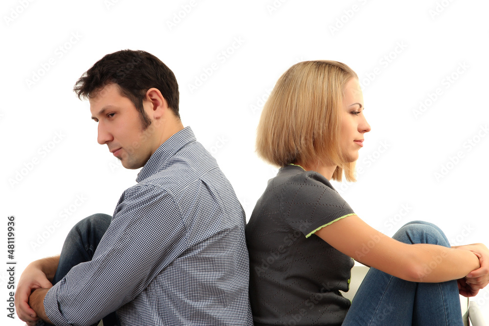 Young couple turning away from each other isolated on white Young couple turning away from each other isolated on white