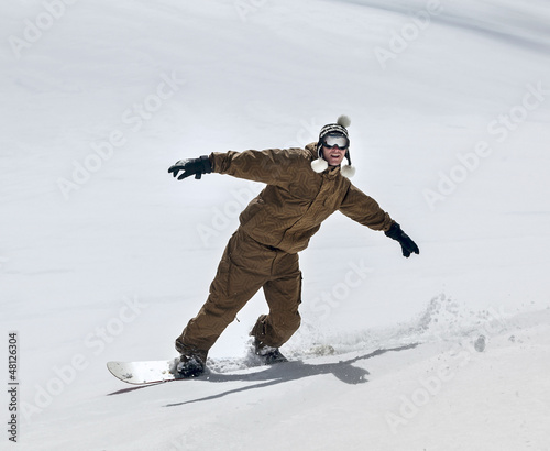 Snowboarder moving down