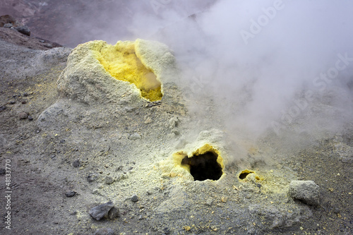 Sulfur fumarole in active volcanic crater photo