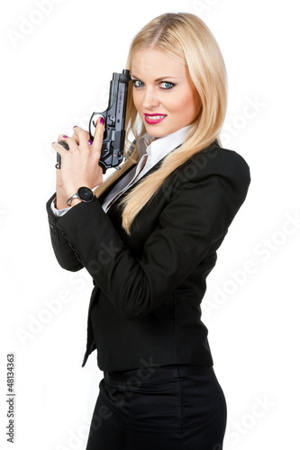 Sexy blonde with a gun on a white background