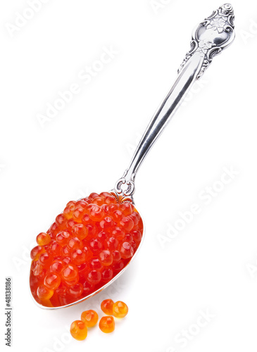 spoon of red caviar isolated on white