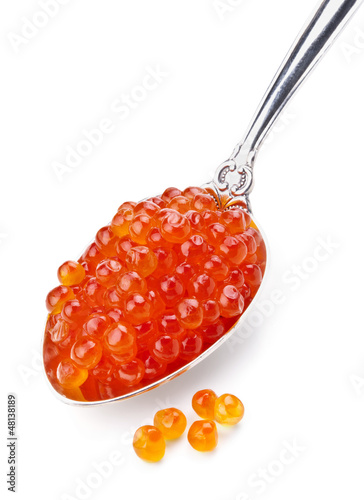 spoon of red caviar on white