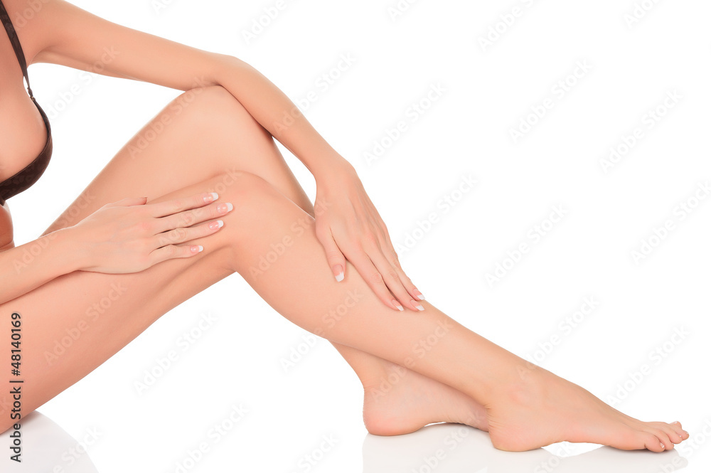 Beautiful woman's legs and hands isolated on white background Beautiful woman's legs and hands isolated on white background