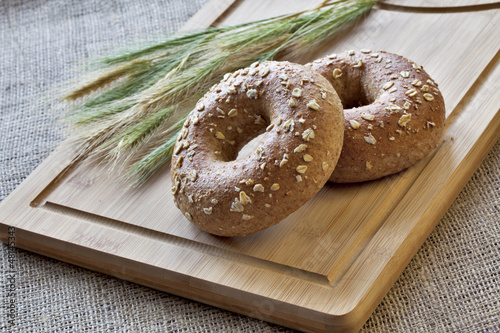 Bagels on bread board photo