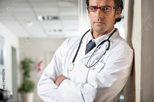 Doctor Standing With Hands Folded
