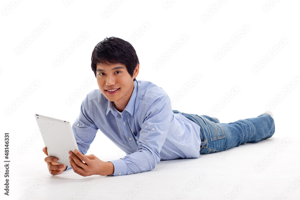 Asian man holding tablet computer isolated on white background. Asian man holding tablet computer isolated on white background.