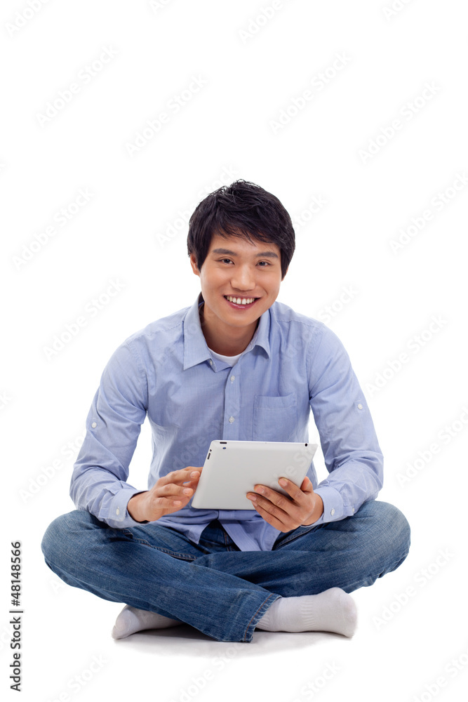 Asian man holding tablet computer isolated on white background. Asian man holding tablet computer isolated on white background.